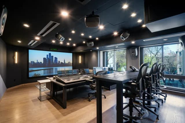 Studio A with daylight through the acoustic windows, client seating and overhead speakers.
