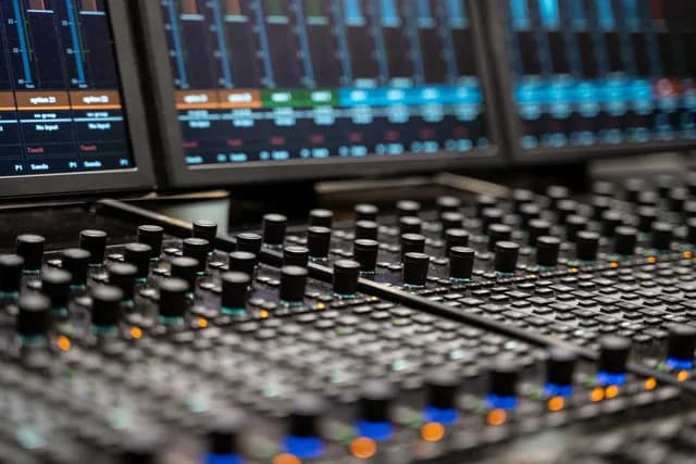 Close-up of Studio A’s console surface, rotary controls and displays.