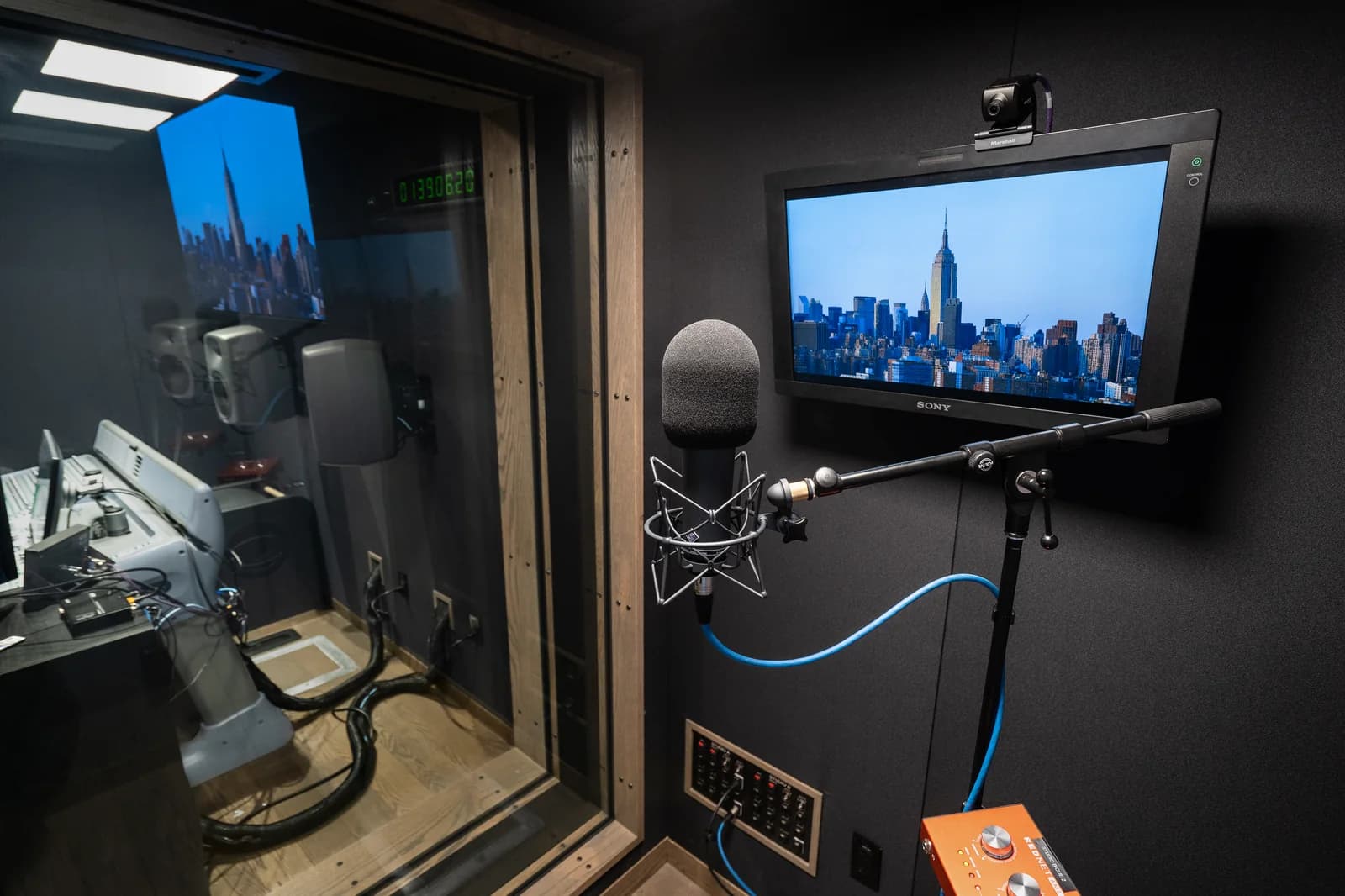 Inside the voiceover booth, looking through the window into Studio B.